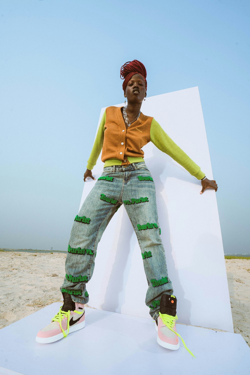 a woman standing on top of a white structure