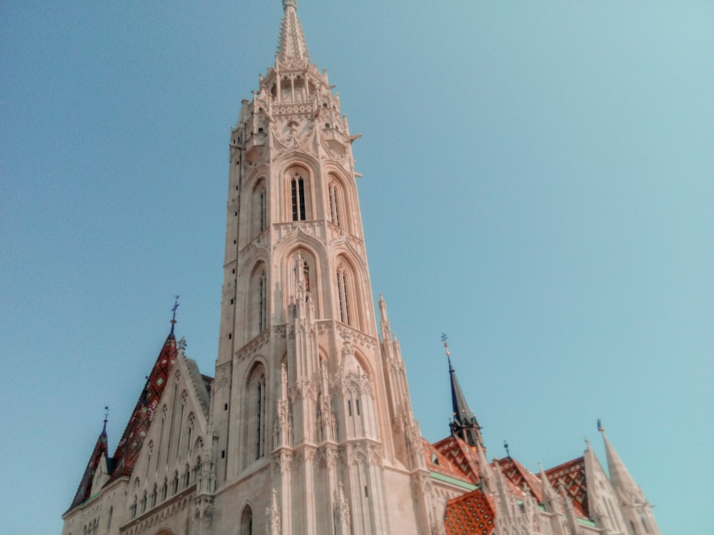 a very tall building with a clock on it's side