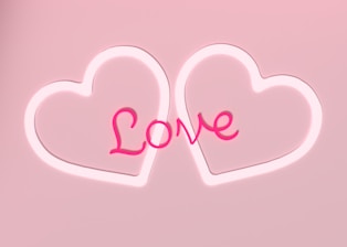 Two outlined heart shapes with the word 'Love' in a cursive style centered between them, all set against a soft pink background.