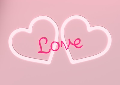 Two outlined heart shapes with the word 'Love' in a cursive style centered between them, all set against a soft pink background.