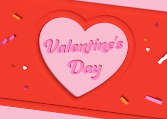 A heart-shaped cutout contains the words 'Valentine's Day' in pink, set against a vibrant red background. Small colored heart and confetti shapes are scattered around, adding a festive touch.