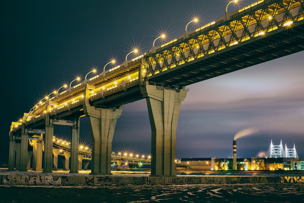 a large bridge lit up at night