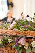 a wicker basket filled with lots of flowers