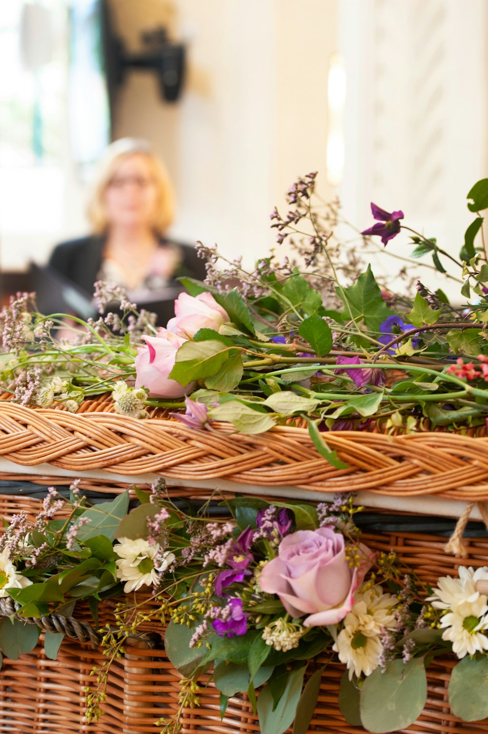 a wicker basket filled with lots of flowers