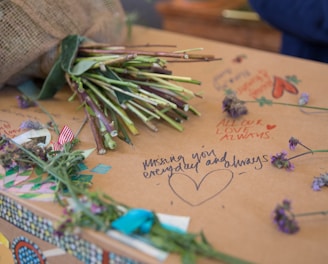 a bunch of flowers sitting on top of a box