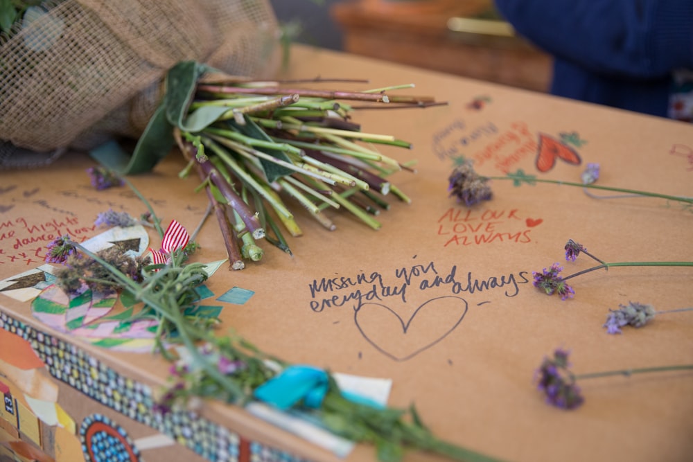 a bunch of flowers sitting on top of a box