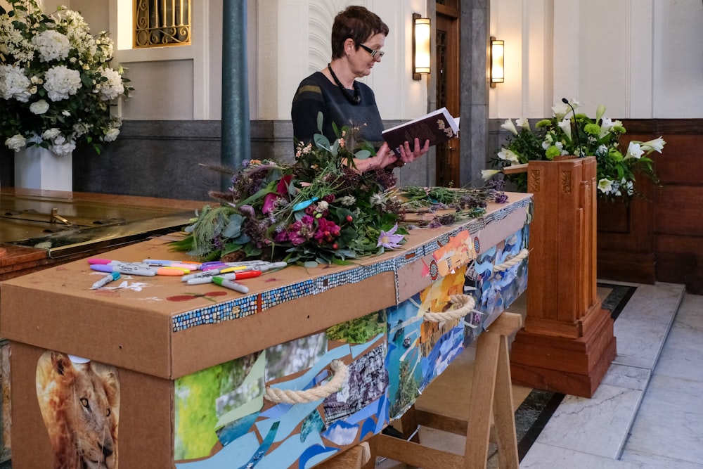 a woman reading a book in a church