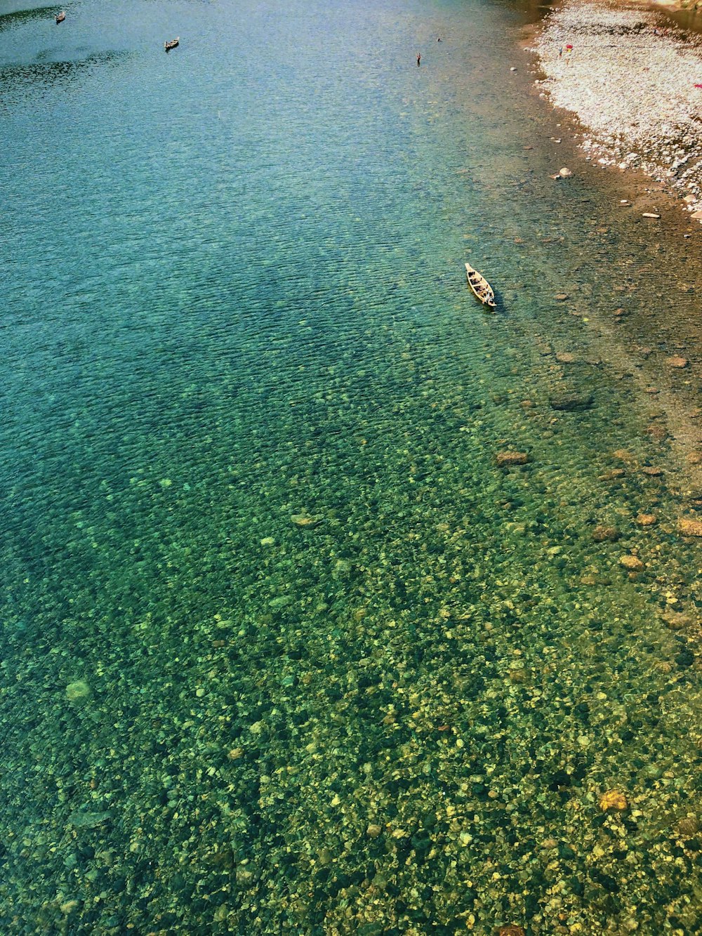 a boat floating on top of a body of water