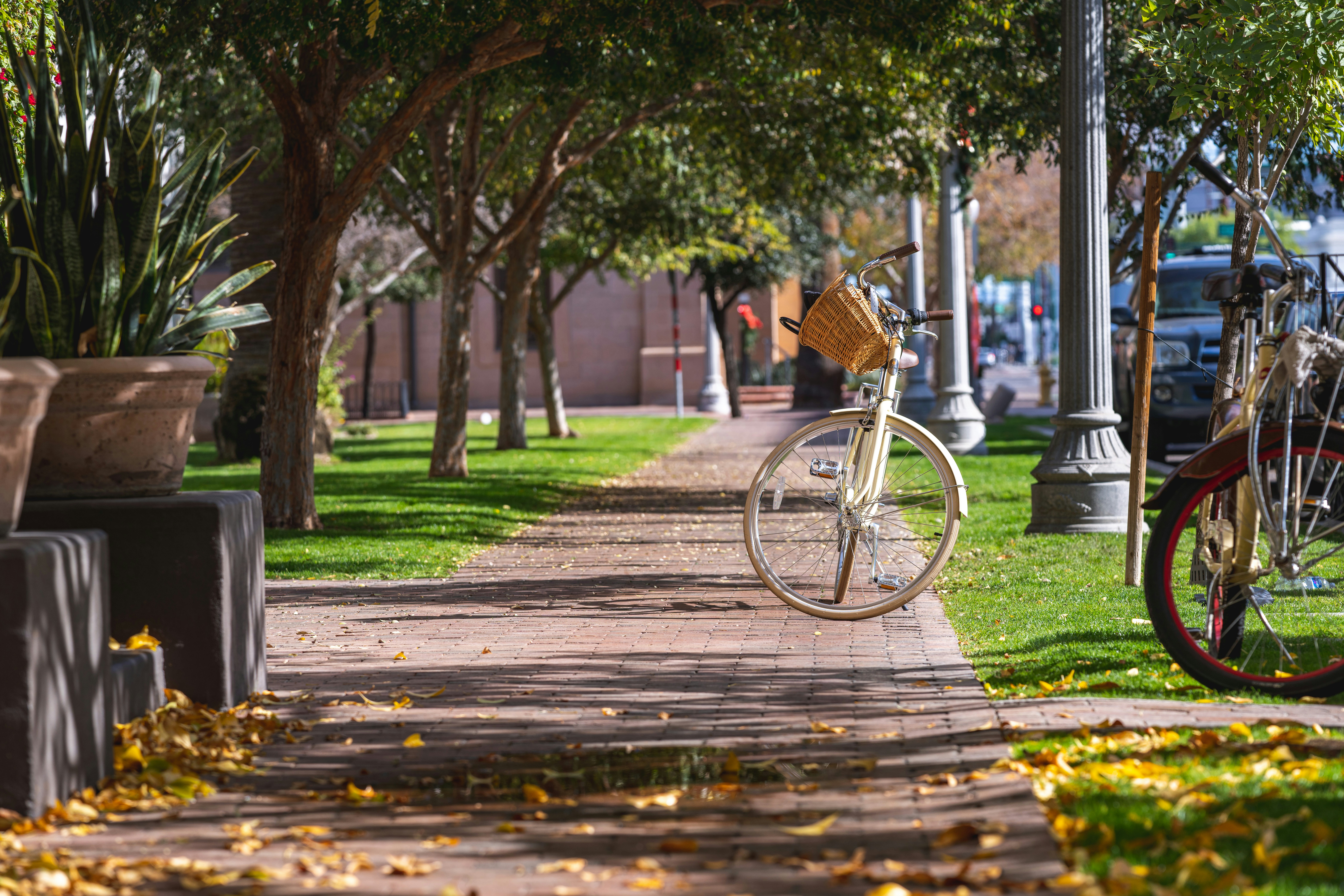 a bike parked on the side of a sidewalk