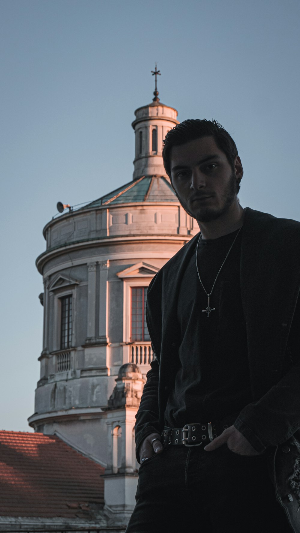 a man is standing in front of a building