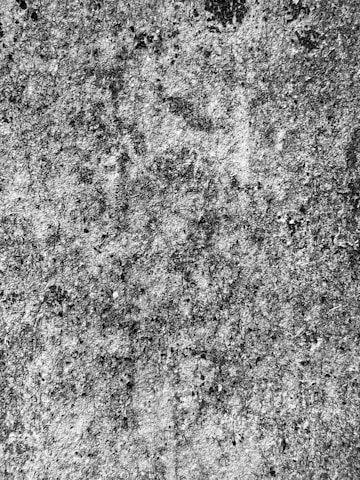 a black and white photo of a concrete wall