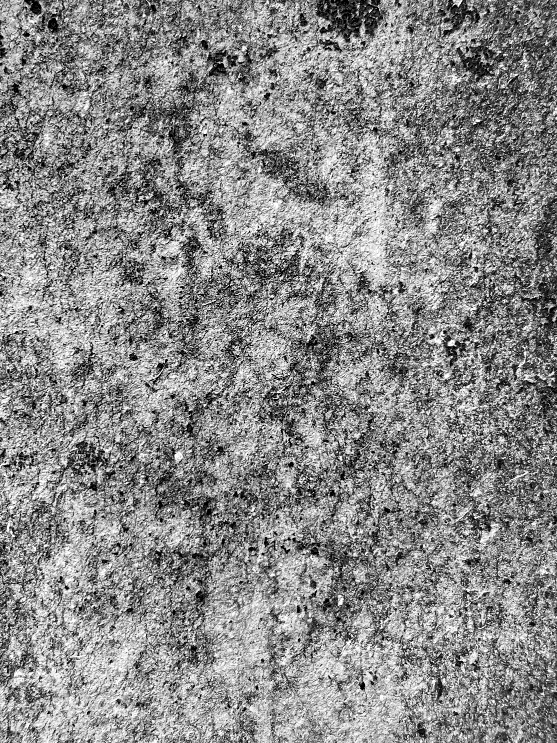 a black and white photo of a concrete wall