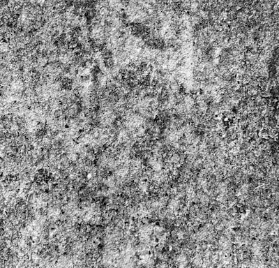 a black and white photo of a concrete wall