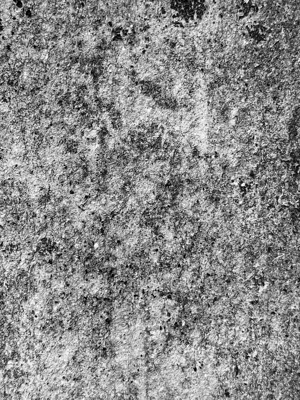 a black and white photo of a concrete wall