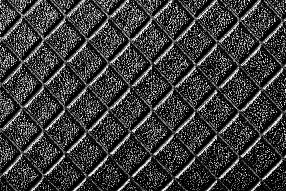 a black and white photo of a textured surface