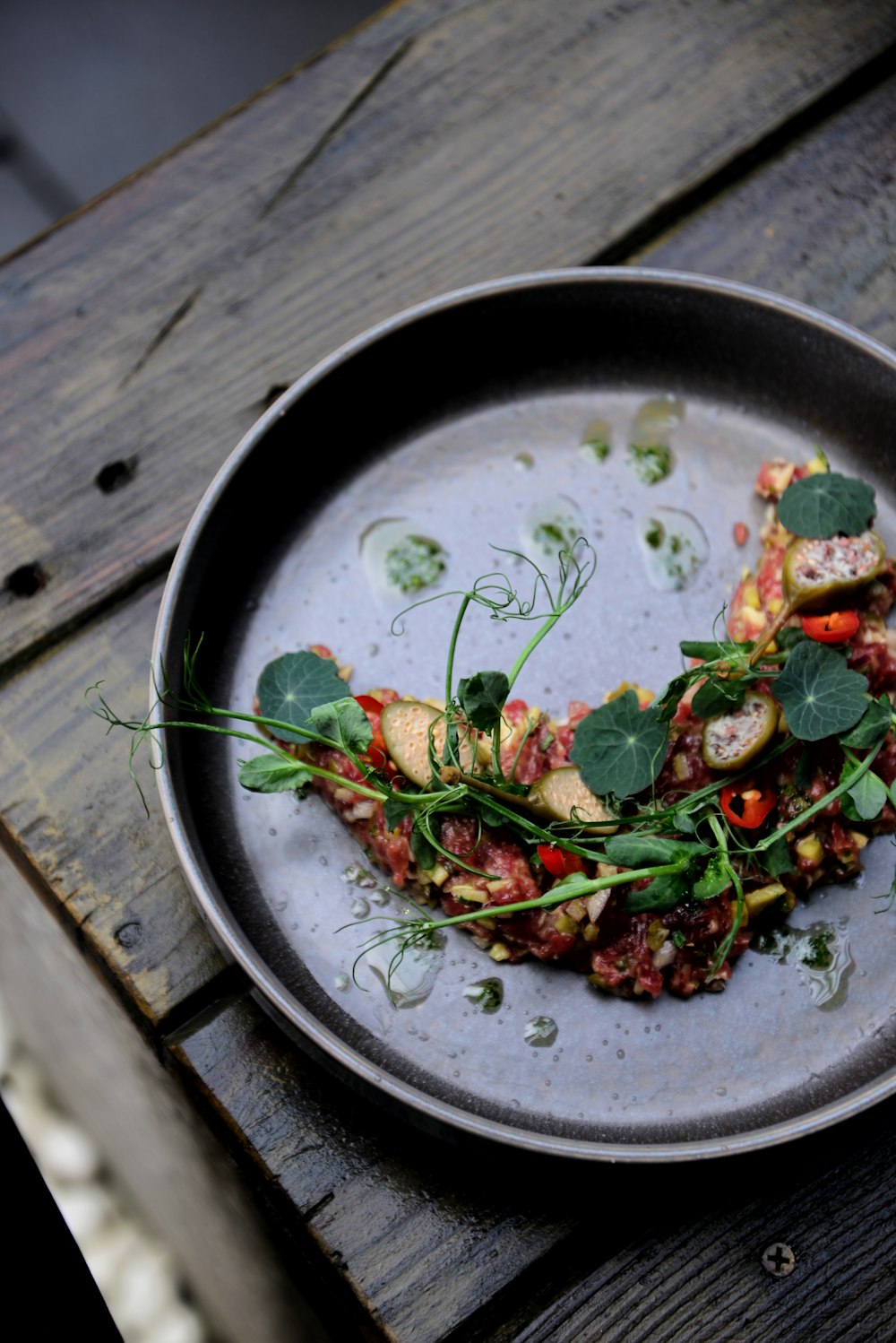 a plate of food on a wooden table