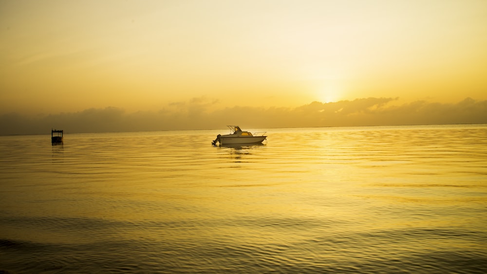 a boat floating on top of a large body of water