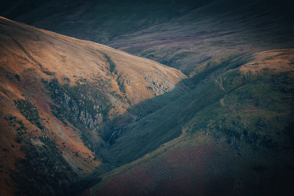 an aerial view of a valley in the mountains