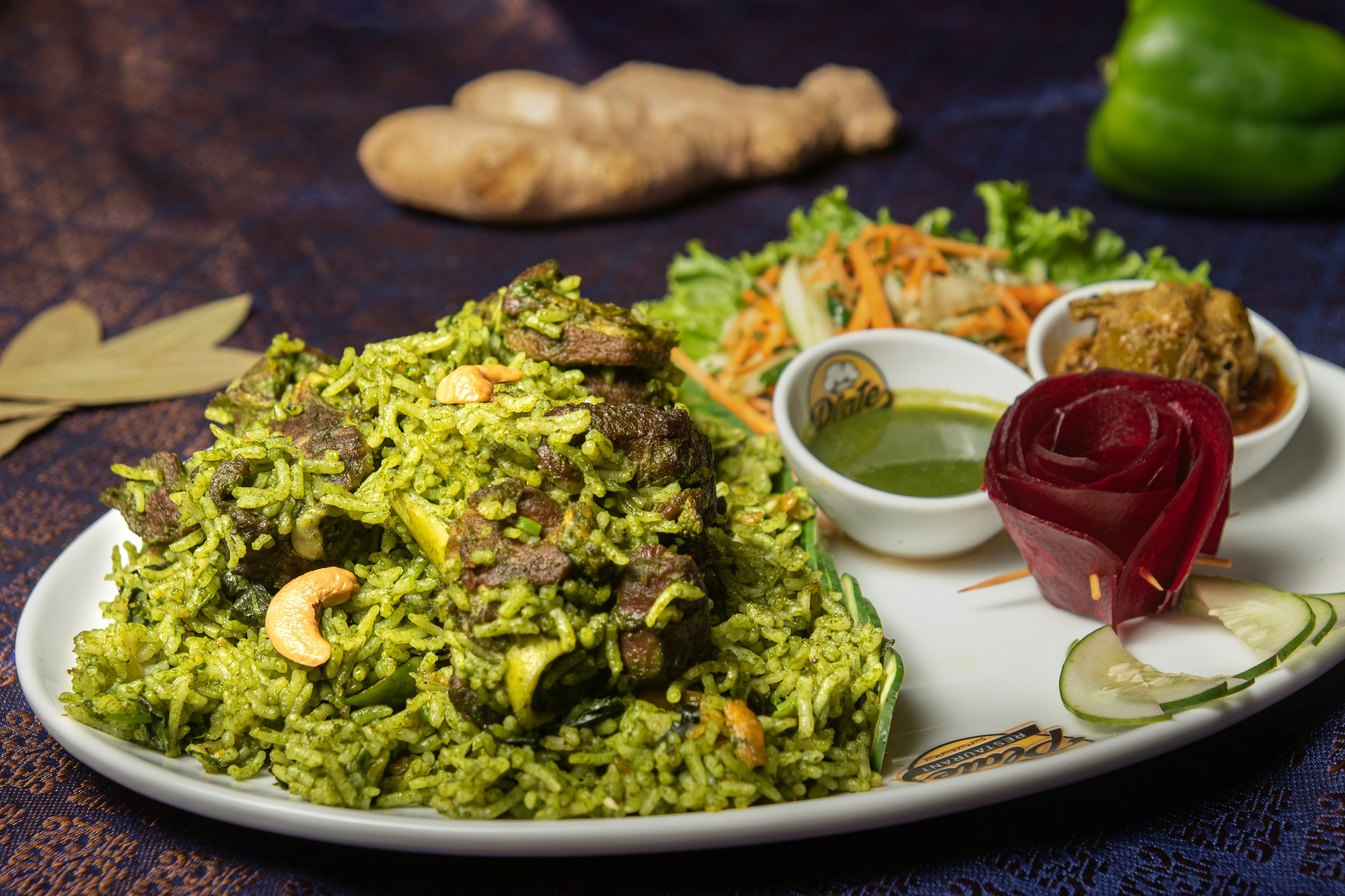 a white plate topped with rice and vegetables