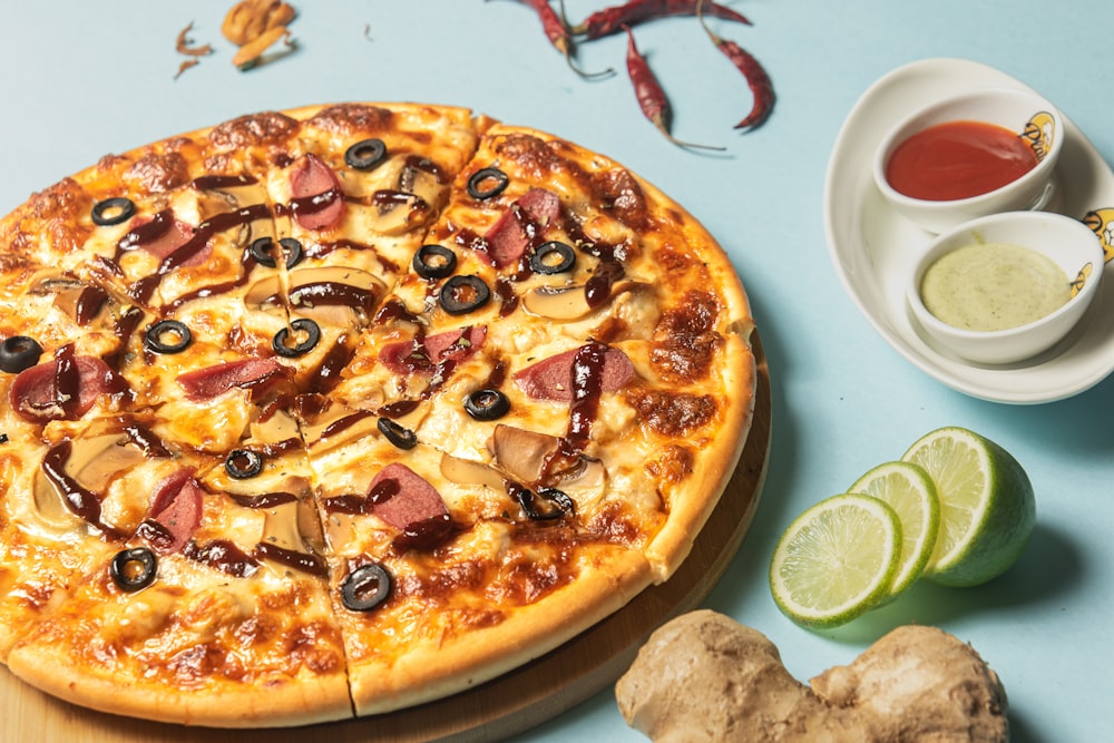 a pizza sitting on top of a wooden cutting board