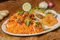 a white plate topped with lots of food on top of a table