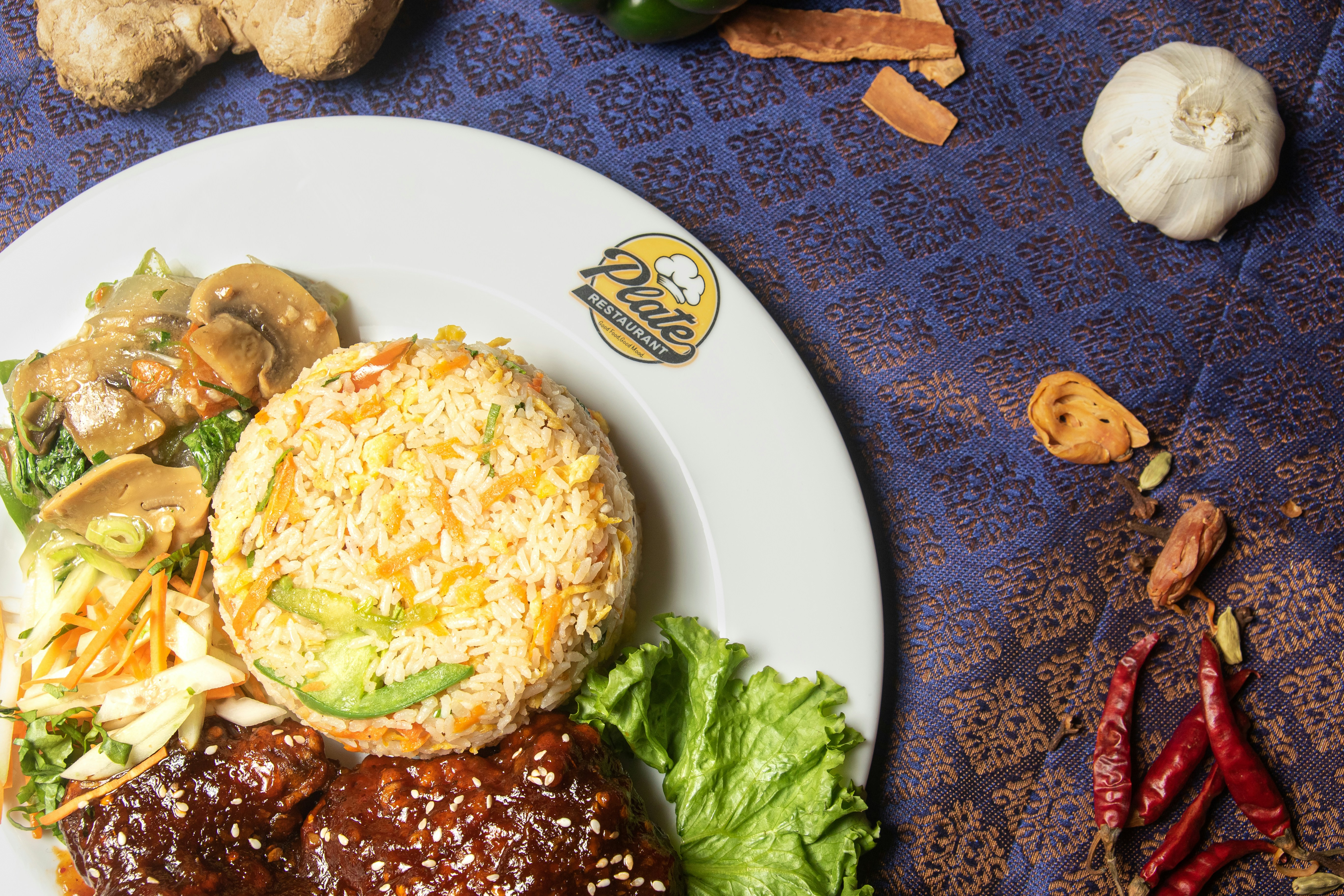 a white plate topped with meat and vegetables