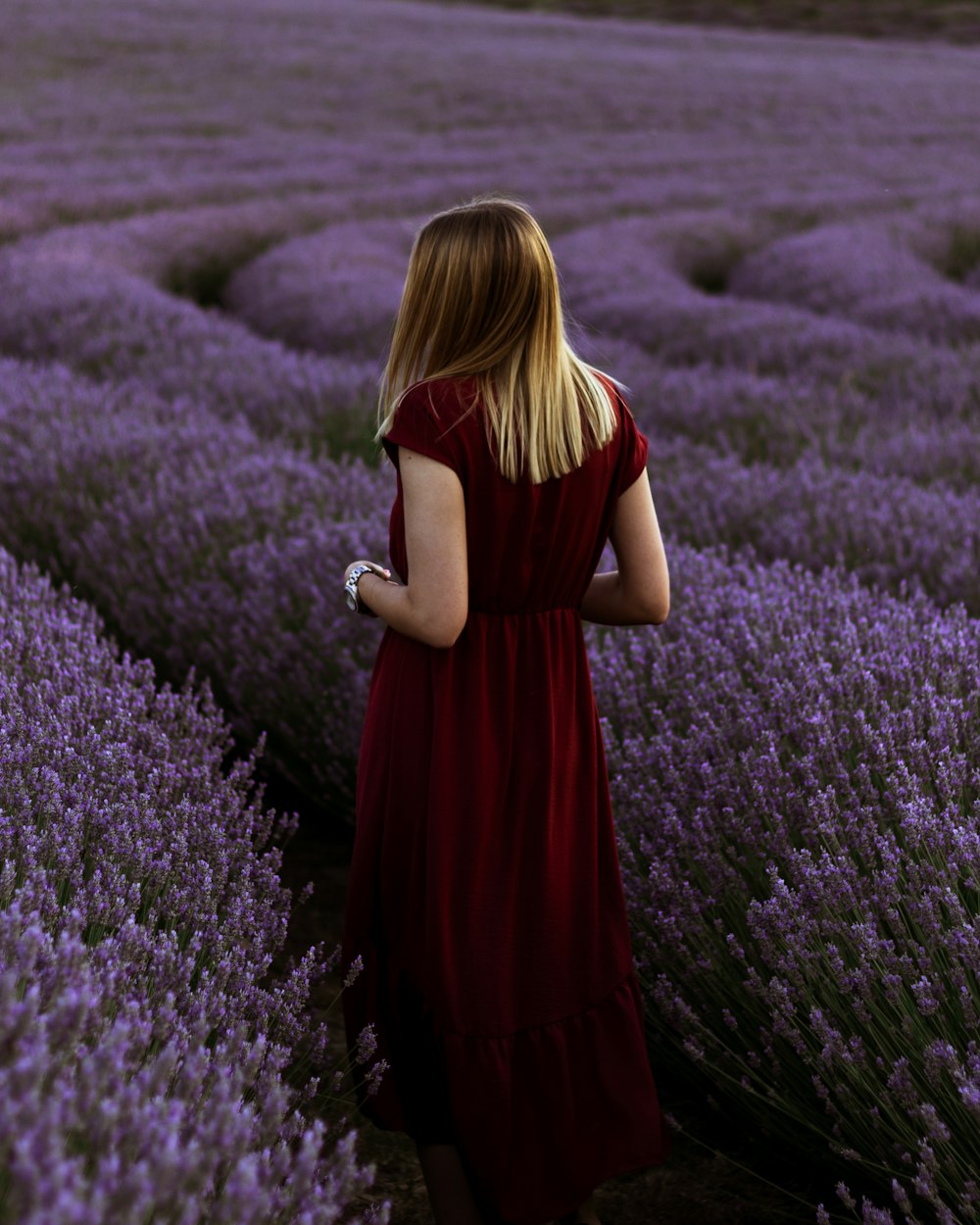 a little girl that is standing in the grass