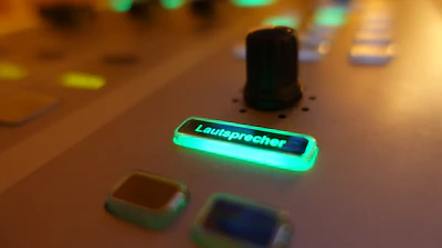Close-up of a red glowing convert button on a clean, dark interface.