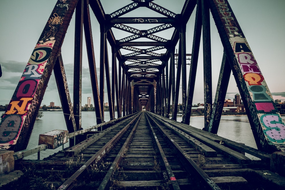 a train track with graffiti painted on it