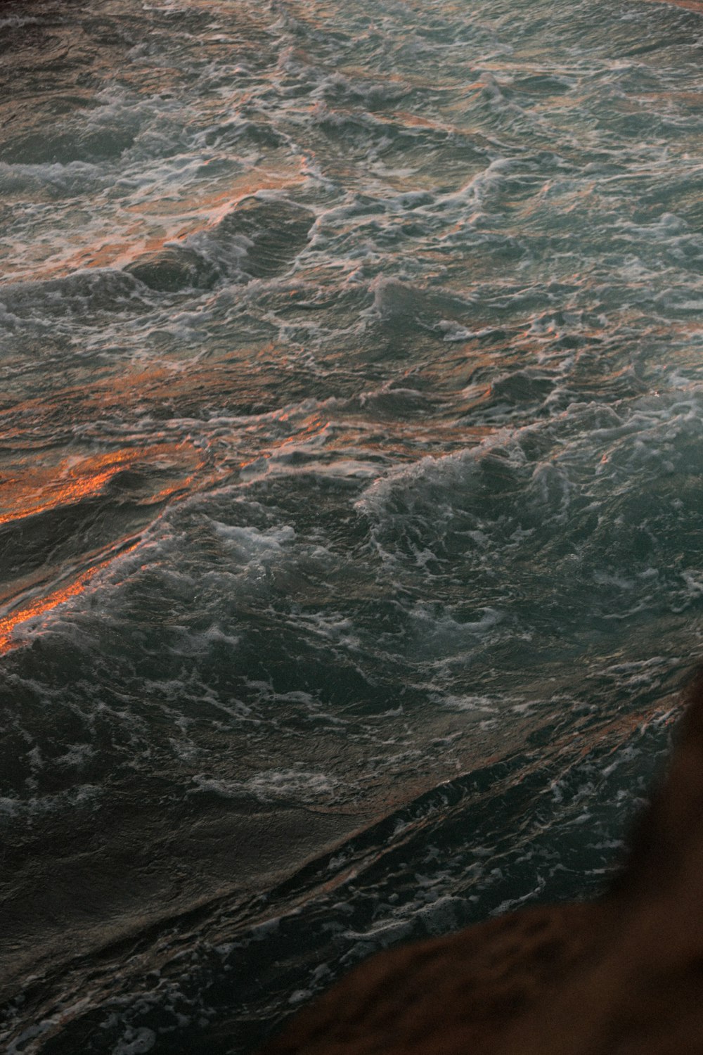 a man riding a wave on a surfboard in the water