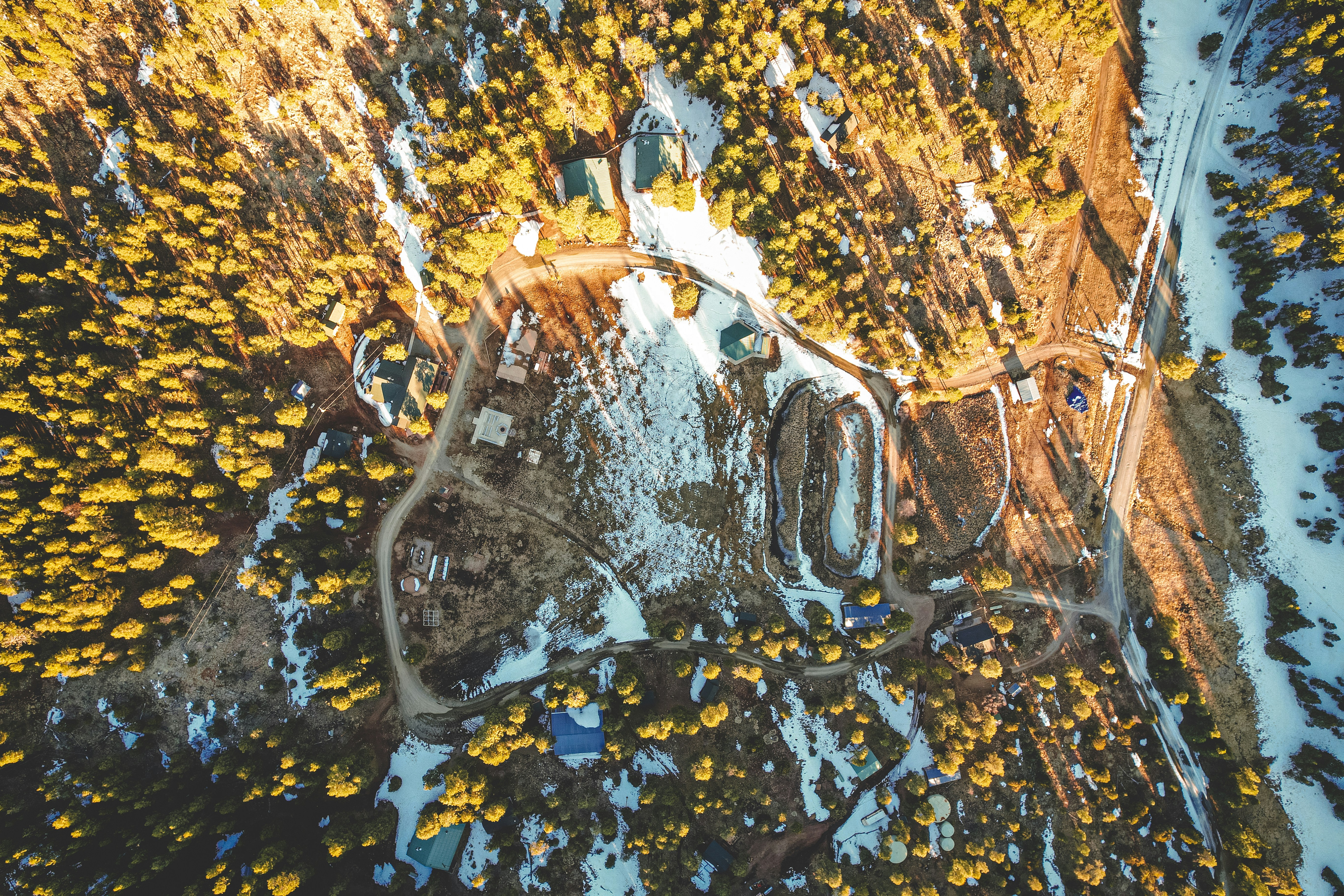 an aerial view of a snow covered park