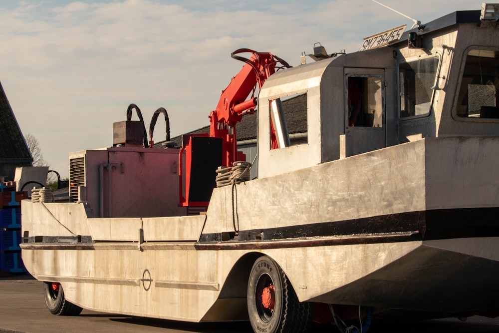 a large boat sitting on top of a parking lot