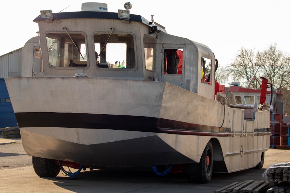 a large boat sitting on top of a parking lot