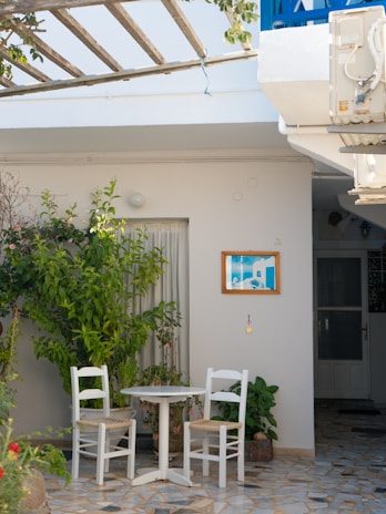 A serene outdoor space with freshly painted patio furniture.