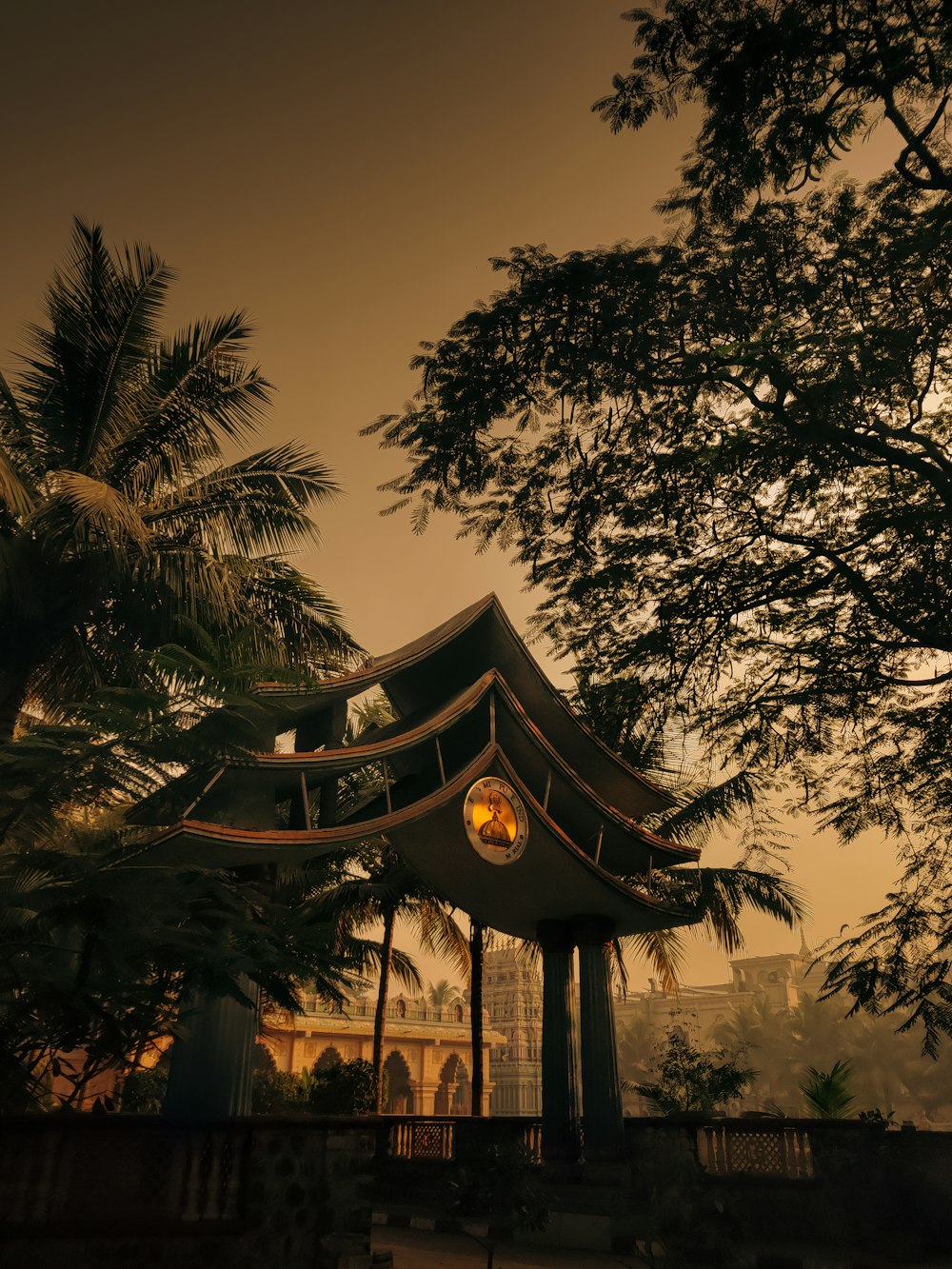 a gazebo surrounded by trees in a park