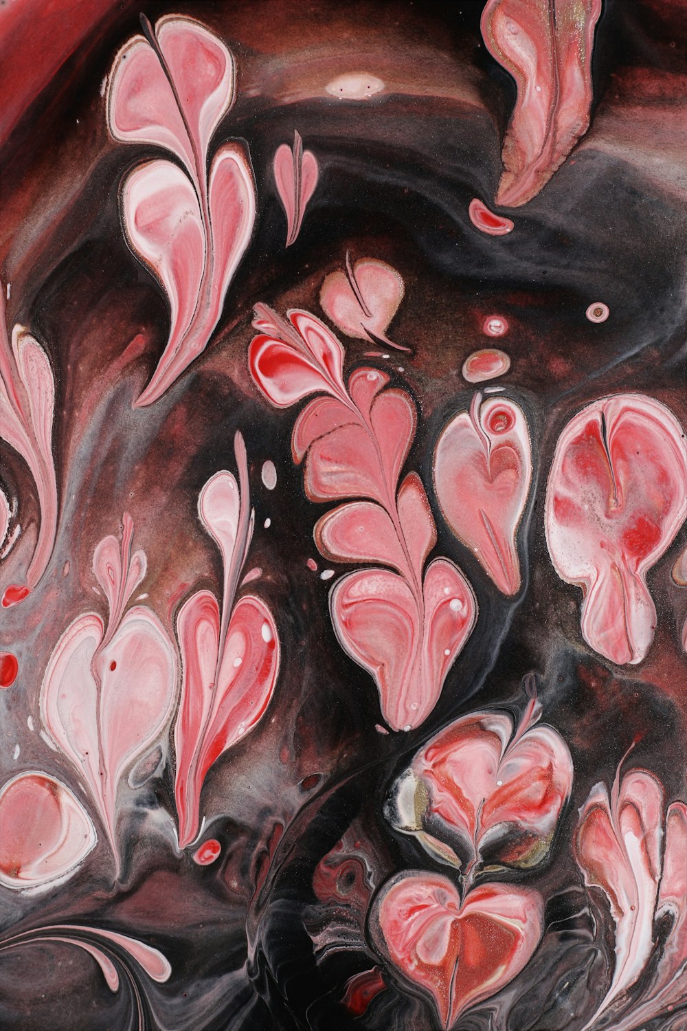 a painting of pink and black flowers and leaves