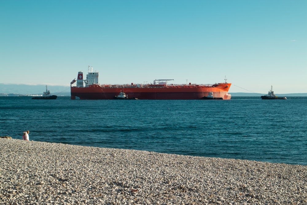 a large cargo ship sitting in the middle of the ocean