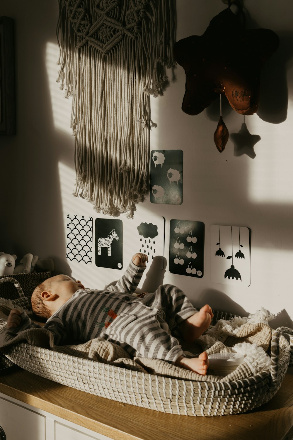 a baby laying on a bed in a room