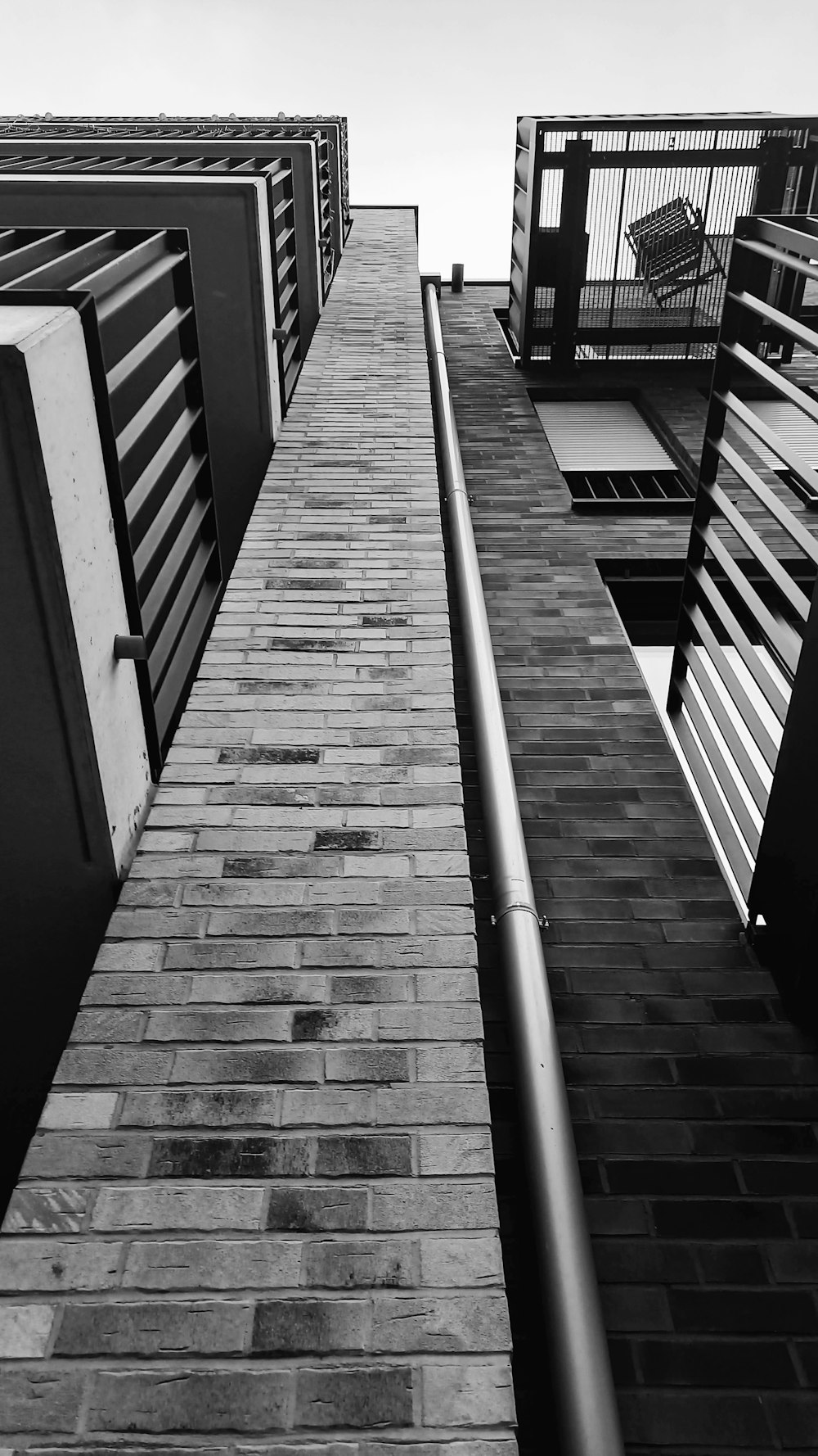 a black and white photo of a brick building