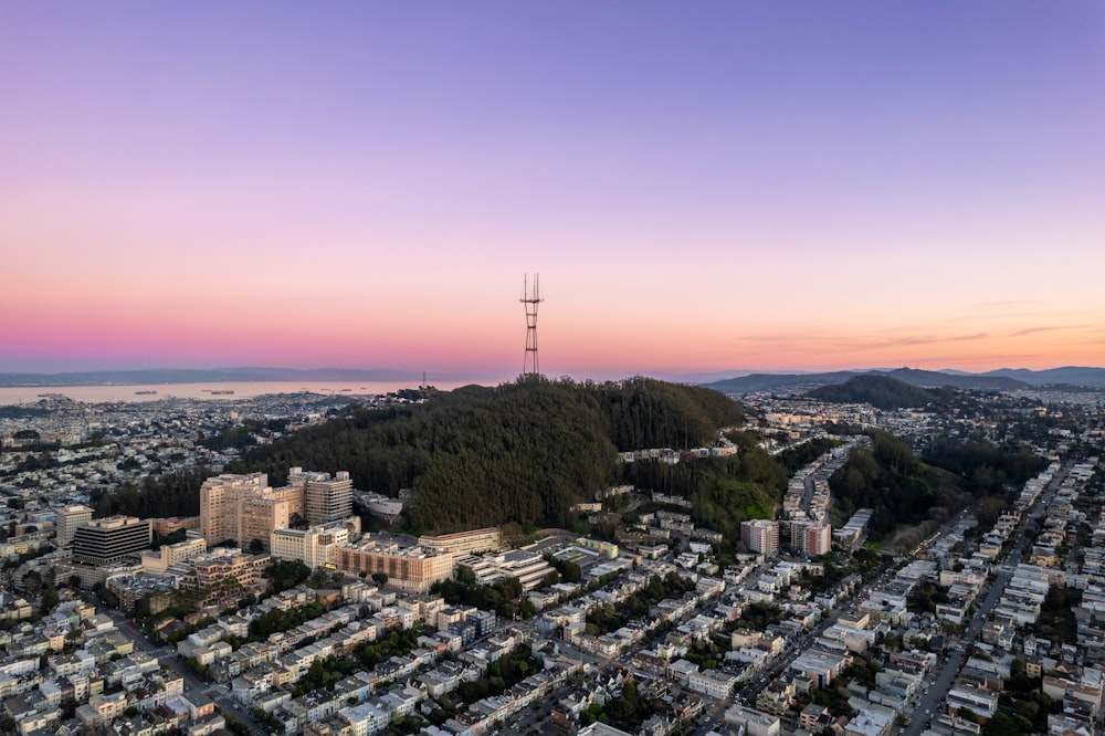 an aerial view of a city at sunset