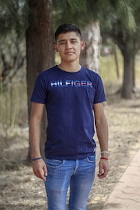 Model wearing casual t-shirt and jeans in natural outdoor setting