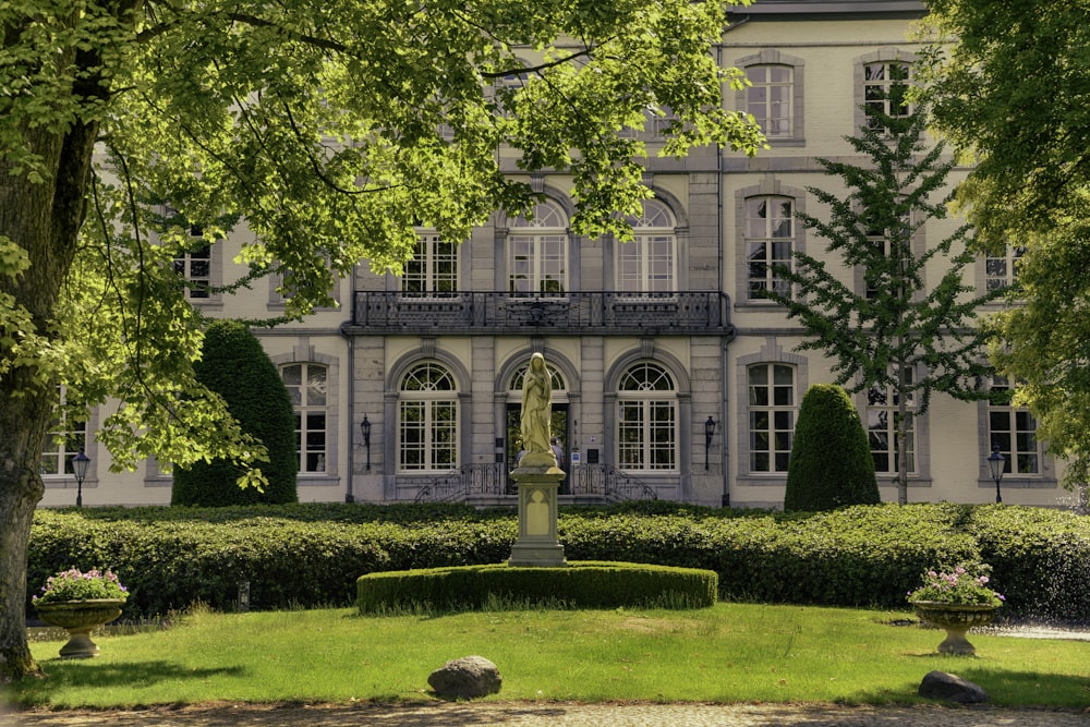 a large building with a fountain in front of it