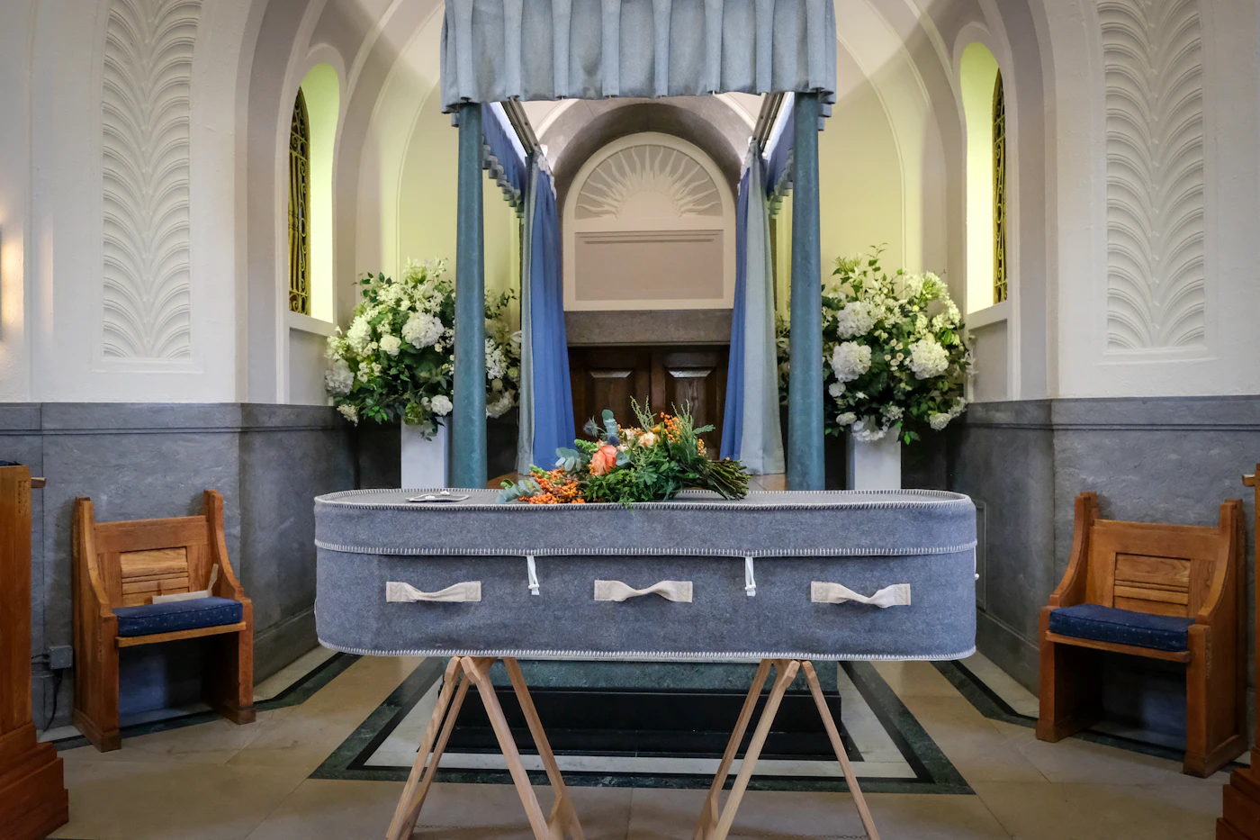 Vintage church decor ideas for traditional ceremonies — A striking floral arrangement embellishes the altar of a traditional church.