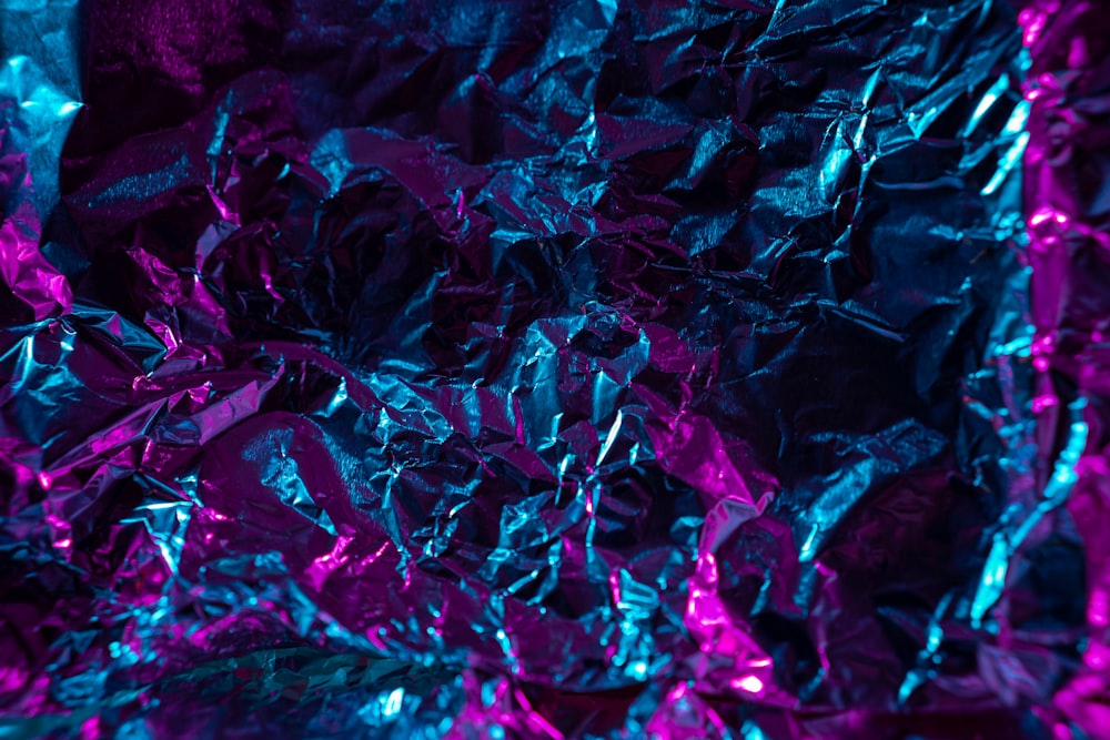 a purple and blue background with tin foil