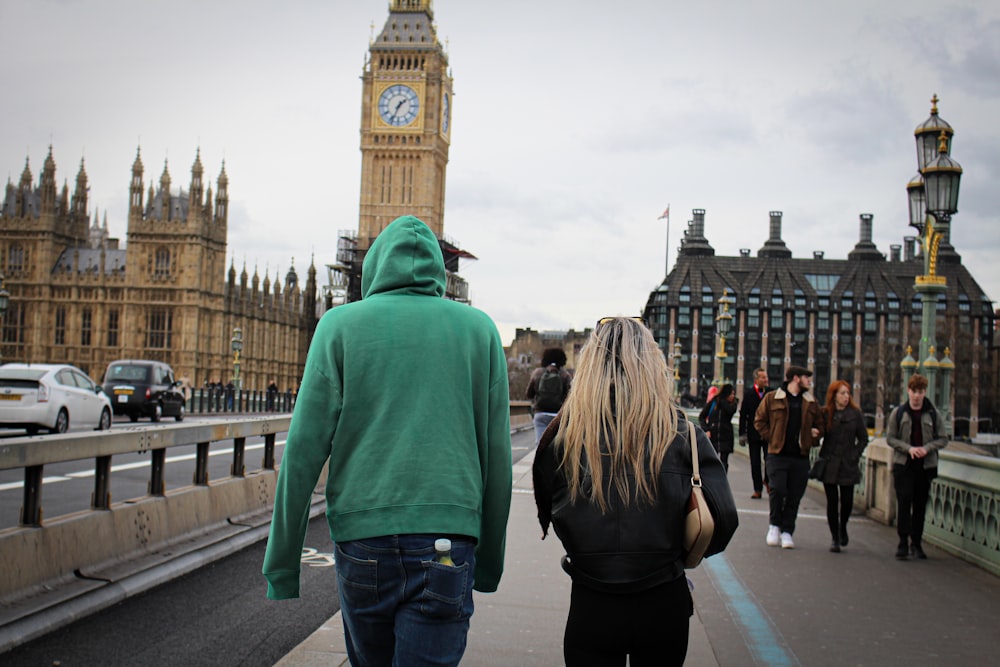 a man and a woman walking down a street