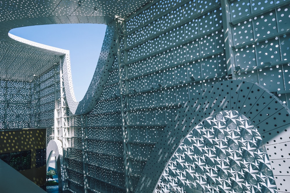 a close up of a metal structure with a sky background