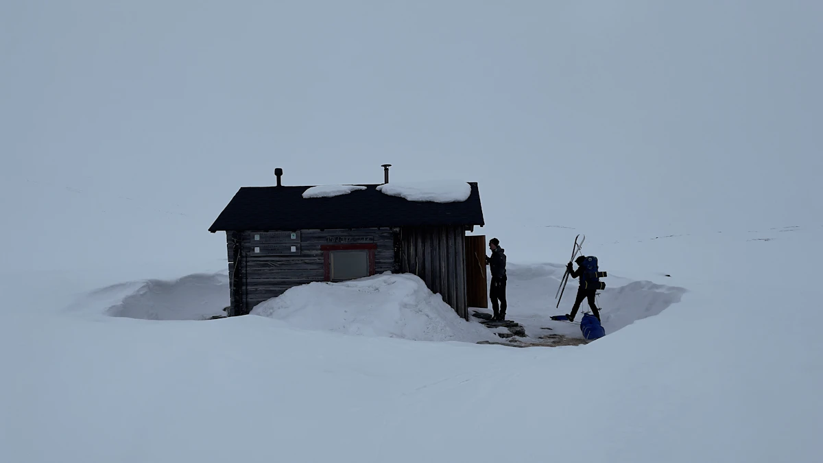 Red timber cabin in deep snow in the Norwegian mountains