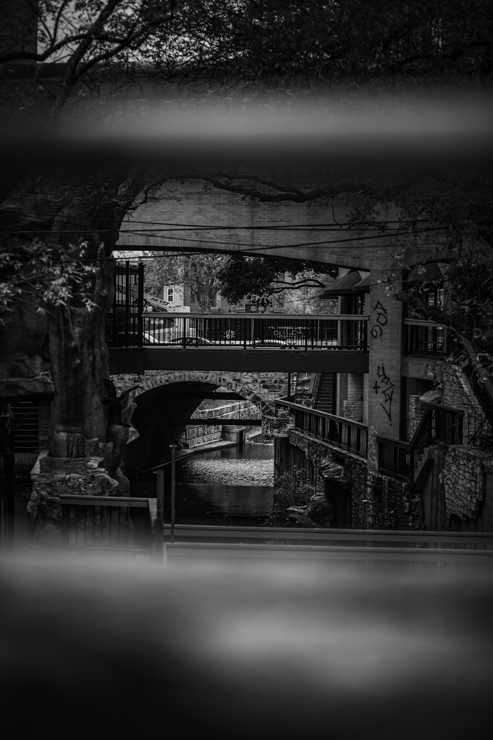 a black and white photo of a bridge