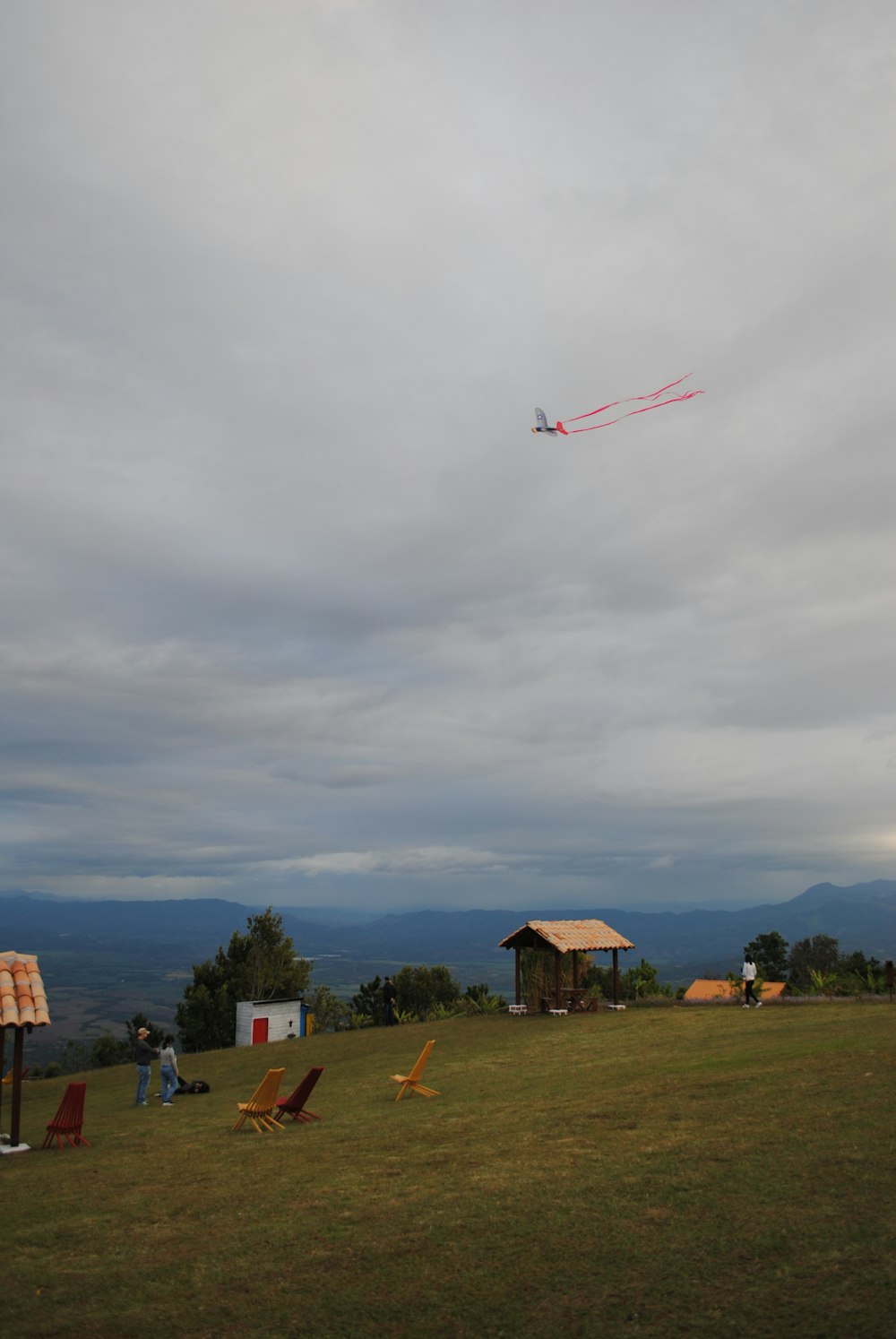 a kite is flying high in the sky