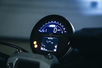 a close up of a speedometer on a motorcycle